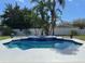 Inviting pool with an integrated spa surrounded by lush landscaping and a white fence at 4412 Conroy Club Dr, Orlando, FL 32835