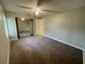 Bedroom featuring mirrored sliding closet doors, ceiling fan, and carpet flooring at 4439 Pinebark Ave # 47-4, Orlando, FL 32811