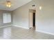 Bright living room with tile flooring, ceiling fan and neutral wall color palette at 4439 Pinebark Ave # 47-4, Orlando, FL 32811