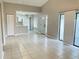 Bright living room with tile floors leading into the kitchen with breakfast bar at 4439 Pinebark Ave # 47-4, Orlando, FL 32811