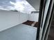 Enclosed patio with a seating area and privacy fence, creating a perfect space for relaxation and outdoor enjoyment at 4439 Pinebark Ave # 47-4, Orlando, FL 32811