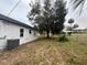 Spacious backyard featuring new AC, mature trees, partial fence and plenty of room to relax at 4900 Grand Ave, De Leon Springs, FL 32130