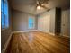 Bedroom with natural light, hardwood floors, and a closet at 4900 Grand Ave, De Leon Springs, FL 32130