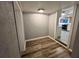 A bright entryway with durable wood-look vinyl flooring and an open view into the kitchen at 4900 Grand Ave, De Leon Springs, FL 32130