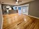 Open floor plan showcasing newly refinished hardwood floors throughout the living spaces at 4900 Grand Ave, De Leon Springs, FL 32130