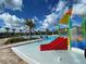 Zero entry splash park with a colorful playset and splash slide at 4934 Chase Ct, St Cloud, FL 34772