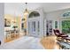 Spacious foyer featuring tile flooring, high ceilings, and views into the dining and living areas at 520 Long Lake Ct, Oviedo, FL 32765