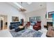 Bright living room with skylights, tile floor, and view of the pool at 520 Long Lake Ct, Oviedo, FL 32765