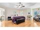 Spacious main bedroom with tray ceiling and wood floors at 520 Long Lake Ct, Oviedo, FL 32765