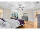 View of a main bedroom with wood floors and tray ceiling at 520 Long Lake Ct, Oviedo, FL 32765