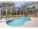 Backyard pool featuring an in-ground spa and a screened-in enclosure that protects it from bugs at 520 Long Lake Ct, Oviedo, FL 32765