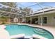 The home features a screened-in pool, patio, and landscaped backyard in a serene setting at 520 Long Lake Ct, Oviedo, FL 32765