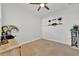 Cozy bedroom featuring carpet flooring, neutral walls, and decorative shelving at 5237 Royal Point Ave, Kissimmee, FL 34746