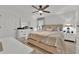 Bright bedroom with neutral color scheme, ceiling fan, and ample natural light at 5237 Royal Point Ave, Kissimmee, FL 34746