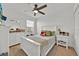 Bright bedroom with ceiling fan, white wood furniture, and neutral decor provides a relaxing space at 5237 Royal Point Ave, Kissimmee, FL 34746