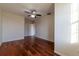 Bedroom with hardwood floors and white trim at 5550 E Michigan St # 3309, Orlando, FL 32822