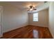 Bedroom featuring hardwood floors, neutral walls, and a window for natural light at 5550 E Michigan St # 3309, Orlando, FL 32822