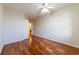 Bright bedroom features hardwood floors and ceiling fan at 5550 E Michigan St # 3309, Orlando, FL 32822