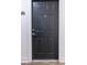 A condo's dark entry door featuring a peephole, stylish door knocker, and unit number at 5550 E Michigan St # 3309, Orlando, FL 32822