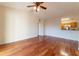 Spacious living room featuring hardwood floors and an open layout to the kitchen at 5550 E Michigan St # 3309, Orlando, FL 32822