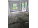 Bedroom featuring sliding glass doors that lead out to a deck area and outdated carpet at 570 Cranes Way # 246, Altamonte Springs, FL 32701