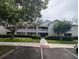 A multi-story building features multiple balconies, well-maintained landscaping, and ample parking at 570 Cranes Way # 246, Altamonte Springs, FL 32701