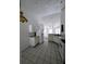 Open-concept kitchen features white cabinets, tile flooring, and modern appliances at 570 Cranes Way # 246, Altamonte Springs, FL 32701