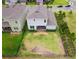 An aerial view of the backyard shows a spacious lawn with perimeter landscaping and fence at 603 Fortuna Dr, Davenport, FL 33837