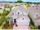 Well maintained exterior elevation with beautiful landscaping and a two car garage at 603 Fortuna Dr, Davenport, FL 33837