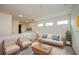 Bright living room with contemporary furnishings and decor, with neutral paint and carpeting at 603 Fortuna Dr, Davenport, FL 33837