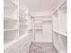 Organized walk-in closet with ample shelving and storage space, drawers, and custom closet system at 603 Fortuna Dr, Davenport, FL 33837