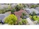 Aerial view of a home with a brown roof and landscaped yard at 6385 Royal Tern St, Orlando, FL 32810