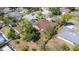 Aerial view of house with brown roof in a wooded neighborhood at 6385 Royal Tern St, Orlando, FL 32810