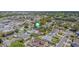 An aerial view showing location in a residential neighborhood with mature trees at 6385 Royal Tern St, Orlando, FL 32810