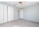 Bedroom with carpet flooring, closet, light walls, and ceiling fan at 6385 Royal Tern St, Orlando, FL 32810