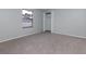 Bedroom featuring a window, closet, and light walls over carpet flooring at 6385 Royal Tern St, Orlando, FL 32810