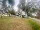 Spacious backyard with shed and mature trees, providing ample outdoor space at 701 S Delaware Ave, Deland, FL 32720