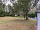 Expansive backyard with mature trees and ample green space at 701 S Delaware Ave, Deland, FL 32720