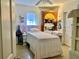 Bright bedroom with charming details including a custom headboard and a built in cupboard at 701 S Delaware Ave, Deland, FL 32720