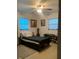 Cozy bedroom with natural light, a comfortable bed, and ample storage space at 701 S Delaware Ave, Deland, FL 32720