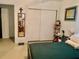 Comfortable bedroom with a closet, mirror, and a relaxing atmosphere at 701 S Delaware Ave, Deland, FL 32720