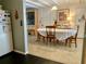 Inviting dining area featuring a large table, artwork and plenty of natural light at 701 S Delaware Ave, Deland, FL 32720