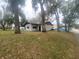 Charming one-story home with mature trees and grass yard at 701 S Delaware Ave, Deland, FL 32720