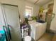 Practical laundry room with washer, dryer and storage at 701 S Delaware Ave, Deland, FL 32720