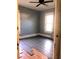 Bedroom with new gray floors, ceiling fan, and a window at 708 S Laurel Ave, Sanford, FL 32771