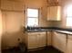 Kitchen featuring white cabinets and a double sink at 708 S Laurel Ave, Sanford, FL 32771