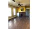 Living room featuring a ceiling fan and brick fireplace at 708 S Laurel Ave, Sanford, FL 32771