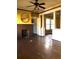 Living room featuring a brick fireplace and ceiling fan at 708 S Laurel Ave, Sanford, FL 32771