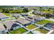 Beautiful aerial view of homes equipped with solar panels, showcasing modern community design and green energy solutions at 756 Kindred Ln, Auburndale, FL 33823