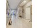 Elegant hallway featuring tile flooring, arched doorways, and stylish décor at 756 Kindred Ln, Auburndale, FL 33823